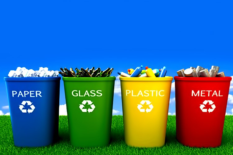 waste recycling bins of different colours for paper, glass, plastic and metal